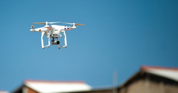 Robotics - Selective Focus Photograph of White Quadcopter Drone during Blue Hour
