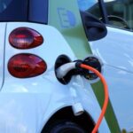Electric Vehicles - White and Orange Gasoline Nozzle