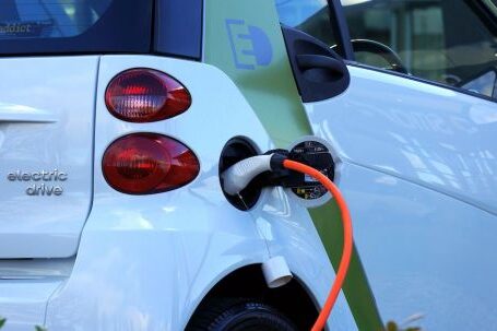 Electric Vehicles - White and Orange Gasoline Nozzle