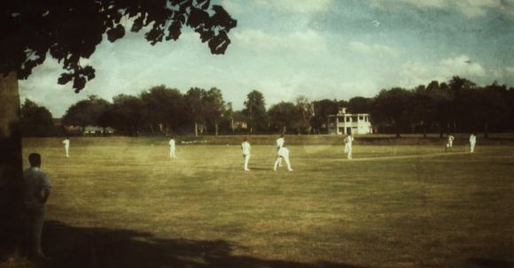Uk Gaming Dominance - People in White Clothes Playing Cricket on Field
